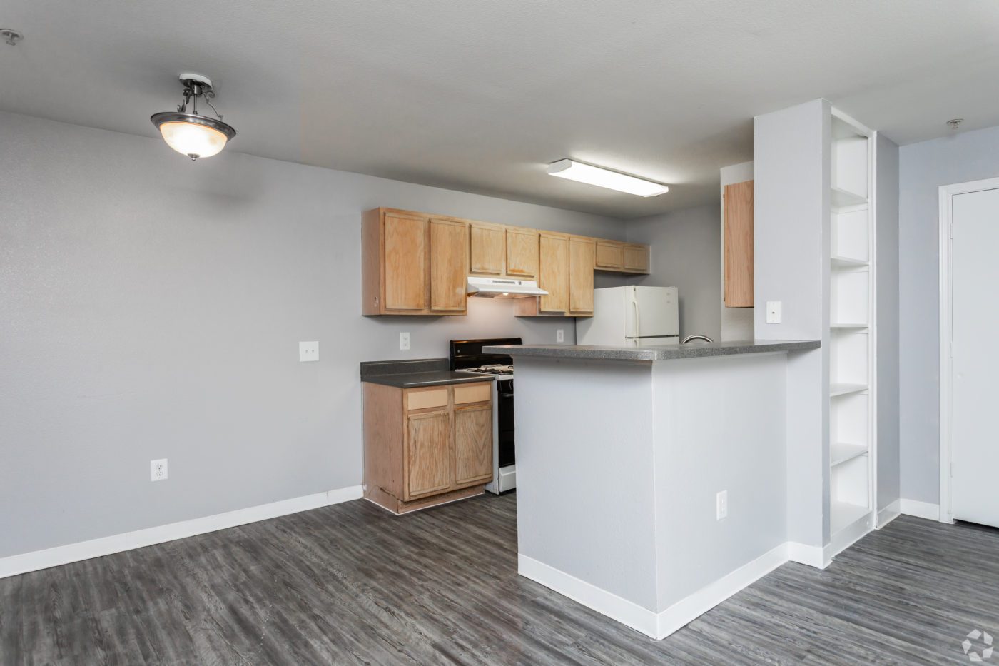 3BR-2BA-1150-SF-Dining-and-Kitchen-grey-floors-grey-paint-scaled - Cable Ranch Apartments