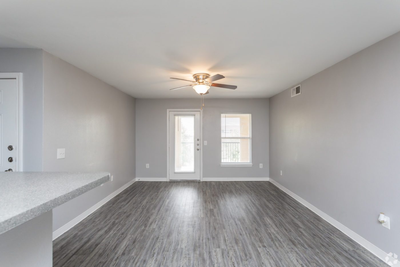 3BR-2BA-1150-SF-Livingroom-grey-floors-grey-paint-scaled - Cable Ranch Apartments